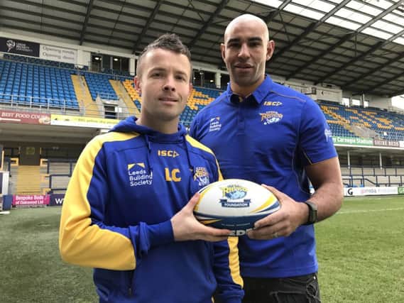 Leon Crick from the Leeds Rhinos Foundation welcomes Chev Walker back to the club.