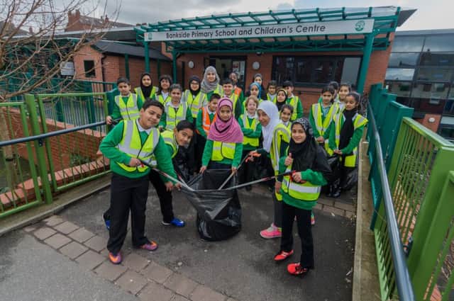A group of pupils calling themselves the 'Litter Magpies' from Bankside Primary School, Harehills, Leeds, are  helping to collect rubbish from areas close to their school.  Pictures: James Hardisty
