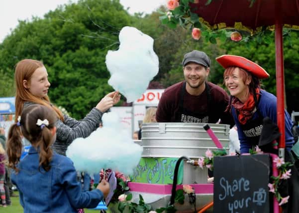 SWEET DAY: Children get some candy floss at last years festival. PIC: Simon Hulme