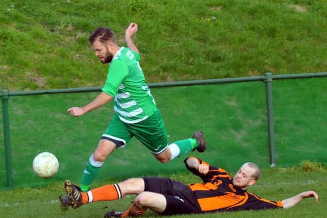 Kippax's Tom Charles takes on the Howden Clough defence. PIC: Steve Riding