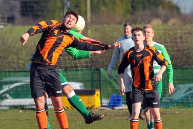 Joe Bedford heads on for Howden Clough. PIC: Steve Riding