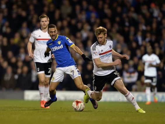 Leeds United's Kemar Roofe and Fulham's Tim Ream challenge for the ball at Craven Cottage on Tuesday night.  Picture: Bruce Rollinson