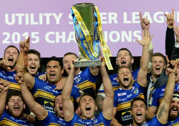 Leeds Rhinos lift the Super League trophy in 2015.