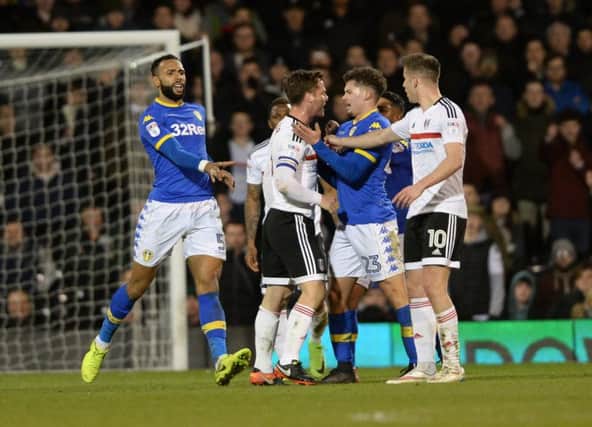 Tom Cairney and Kalvin Phillips square up to each other prior to the Leeds man's dismissal for a second bookable offence at Craven Cottage on Tuesday. PIC: Bruce Rollinson