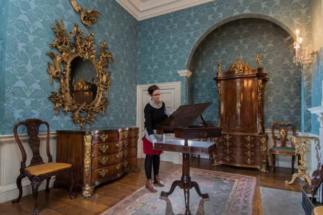 Rachel Conroy, curator at Temple Newsam, Leeds, admiring their newly acquired mechanised reading and writing desk expertly crafted more then 270 years ago.  PIC: James Hardisty
