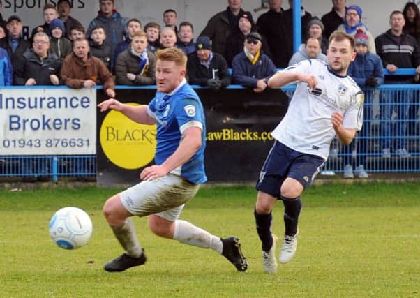 Will Hatfield shoots ide for Guiseley.