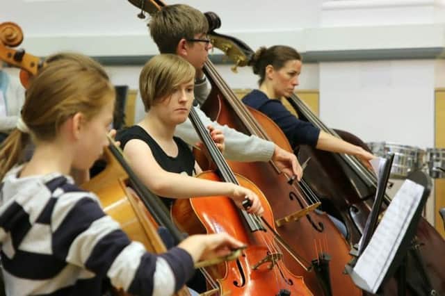 STRING SECTION: Young players practice their skills. PIC: Opera North
