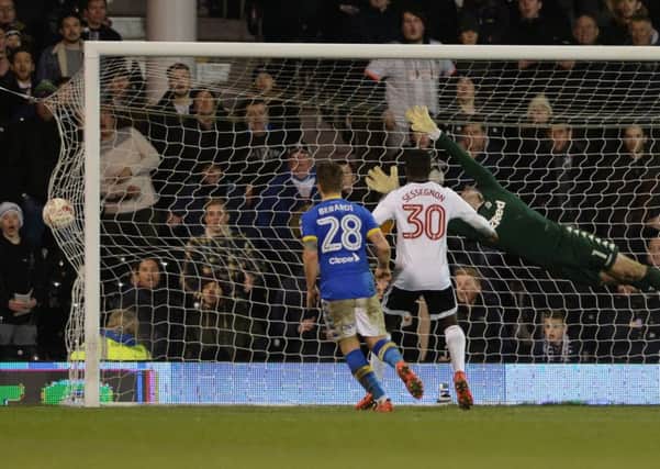 Tom Cairney's scores past Rob Green.