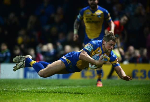 Jimmy Keinhorst flies over the line for the Rhinos third try.