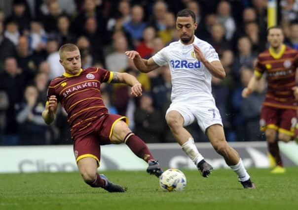 Kemar Roofe is challenged by Jake Bidwell. PIC: Simon Hulme