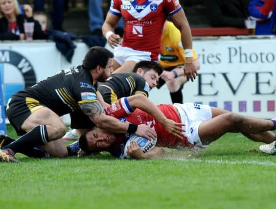 Wakefield's Reece Lyne goes over for the first of his two tries against Salford. PIC: Jonathan Gawthorpe