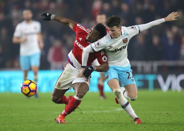 Sam Byram battles for the ball with Middlesbrough's Adama Traore. PIC: PA