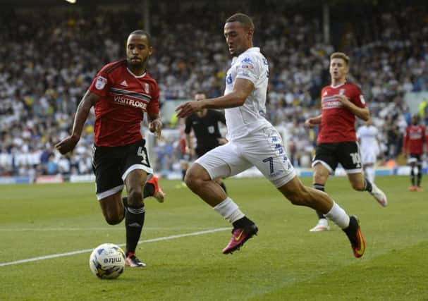 Kemar Roofe is chased down by Fulham's Denis Odoi. PIC: Bruce Rollinson