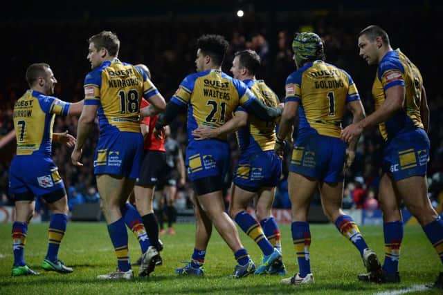 Leeds Rhinos captain Danny McGuire is congratulated on his try against Catalans Dragons.  PIC: Bruce Rollinson