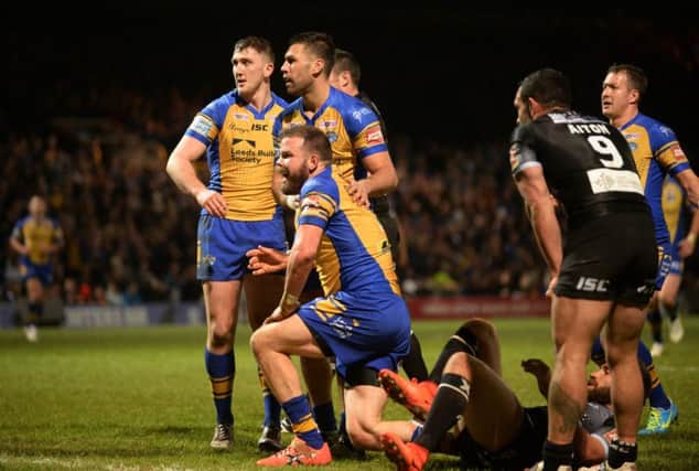 Adam Cuthbertson celebrates scoring the Rhinos' opening try against Catalans Dragons.  PIC: Bruce Rollinson