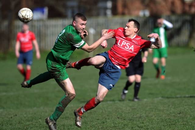 Joe Hirst, of New Pudsey, challenges Bramley's Scott Barlow.PIC: Jonathan Gawthorpe