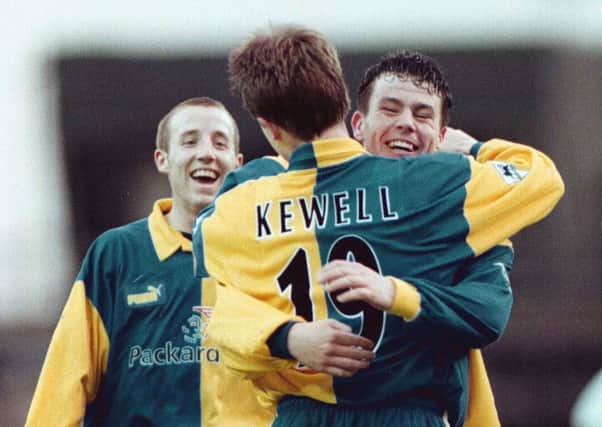 Harry Kewell is congratulated after scoring Leed's fourth goal by Ian Hart and Lee Bowyer during the Premiership clash between Derby v Leeds at Pride Park. It finished 5-0. PIC: PA