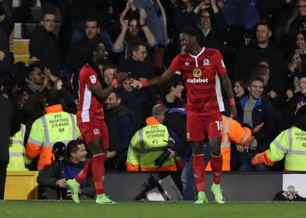 Lucas Joao (right) celebrates with teammate Marvin Emnes (left) in front of the travelling Blckburn Rovers fans after scoring the equalising goal in time at Craven Cottage. PIC: PA