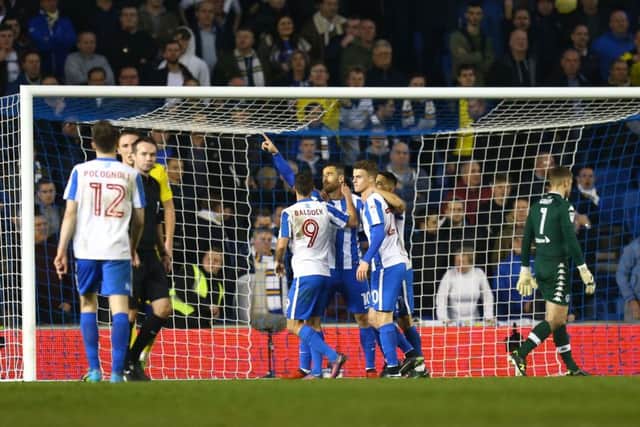 Brighton and Hove Albion's Tomer Hemed (centre) celebrates scoring his side's second goal of the game during the Sky Bet Championship match at the AMEX Stadium. PIC: PA