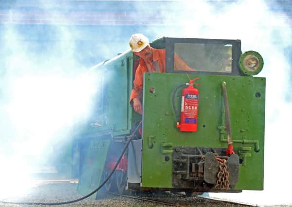 19 March 2017.......   Les Kelly fires up the Hudswell Clarke 100 HP loco as part of  the 'See How They Run Family Science Day at the National Coal Mining Museum for England. Picture Tony Johnson.