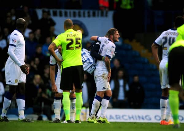 BAD DAY: Leeds United's Liam Cooper, is helped off the field during last year's defeat at Elland Road to Brighton. Picture: James Hardisty.
