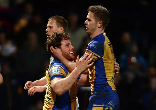 Anthony Mullally celbrates his try with Matt Parcell.