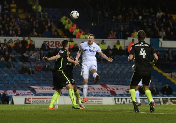 Chris Wood heads in Leeds' opening goal.