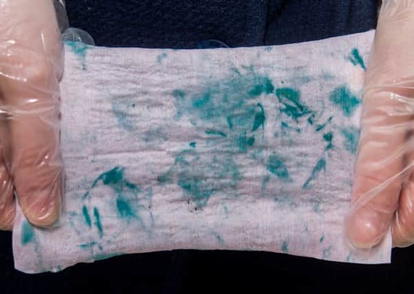 One of the drug testing wipes which turned blue after coming into contact with traces of cocaine.