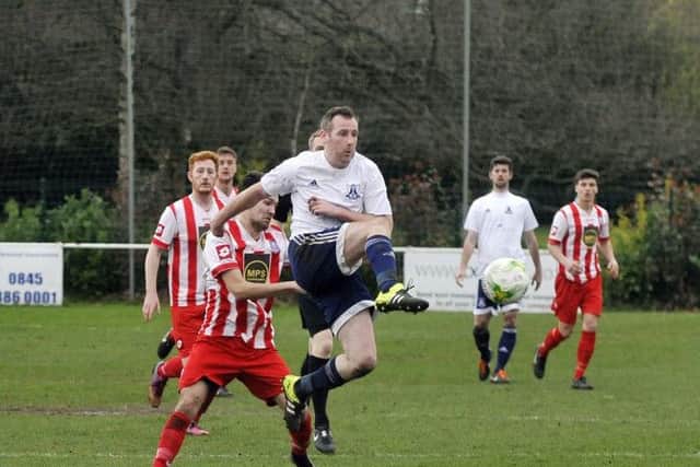 Steve Tierney flicks the ball on for Leeds City against Carlton Athletic. PIC: Steve Riding