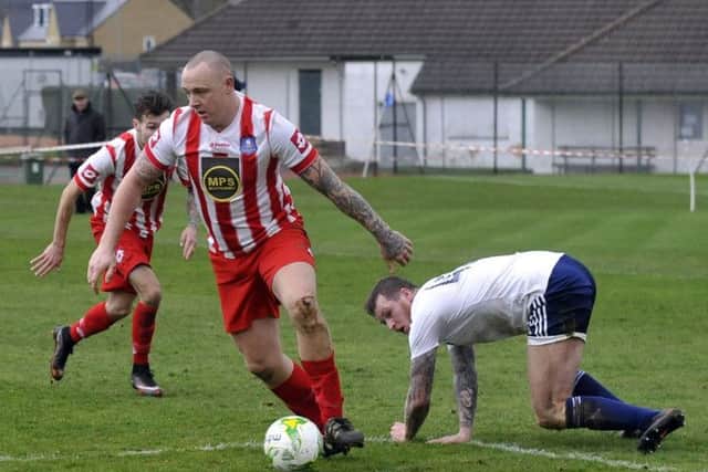 Scott Armstrong wins the ball for Carlton at Leeds City. PIC: Steve Riding