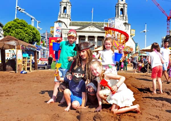 GOOD TIMES: Family fun as Leeds makes the best use of the city centre with a pop-up beach.