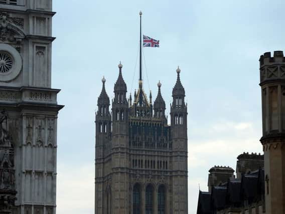 The flag above the Houses of Parliament in London flies at half mast the day after a terrorist attack where police officer Keith Palmer and three members of the public died and the attacker was shot dead.
