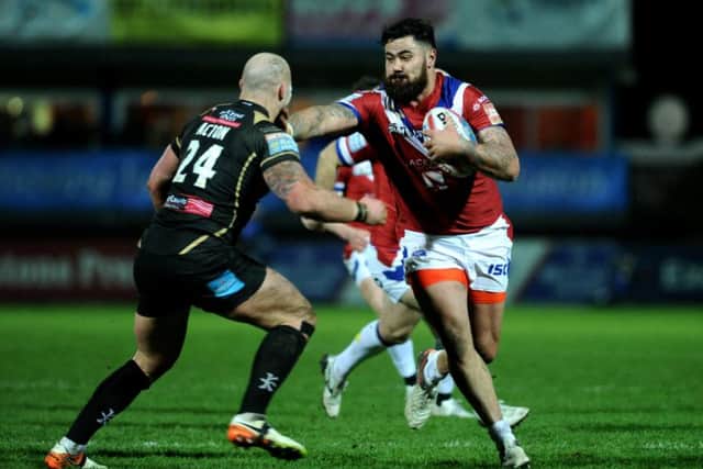 Wakefield's David Fifita takes on Leigh's Jamie Acton.