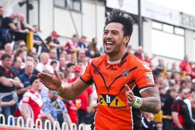 Denny Solomona celebrates a try for Castleford Tigers