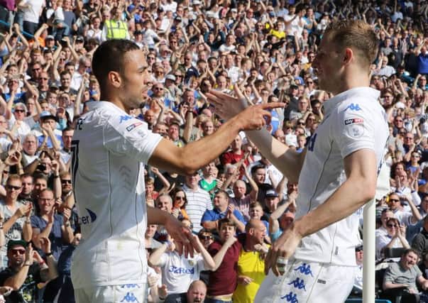 Kemar Roofe celebrates his goal with Chris Wood.