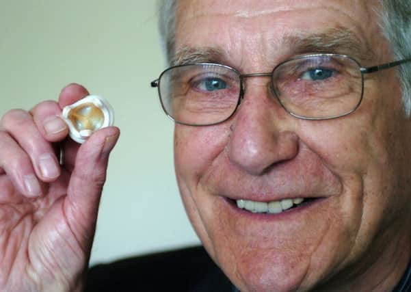 David Watson with the Aspire heart valve he developed.