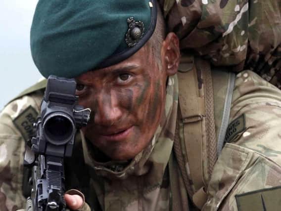 The Royal Marines will lose 200 posts as the Royal Navy seeks to reshuffle its staff before the arrival of a new generation of vessels.