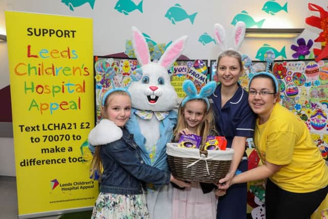 Date:12th April 2017.
Picture James Hardisty.
Leeds General Infirmary Children's Hospital, Clarendon Wing, Leeds, are holding an Easter Day Eggstravaganza for members of the public and patients, able to pet a couple of Donkeys from The Donkey Sanctuary, aswell as chocolate prizes to be won in the enterance of the hospital and drawing competitions on the children's wards. Pictured The LGI's Easter Bunny, with Debbie Smith, Senior Sister, Emily, 9, and Evie 7, Smith, of Halifax, and Jemma Richmond, Fund Raising Co-ordinator for Leeds Children's Hospital Appeal.