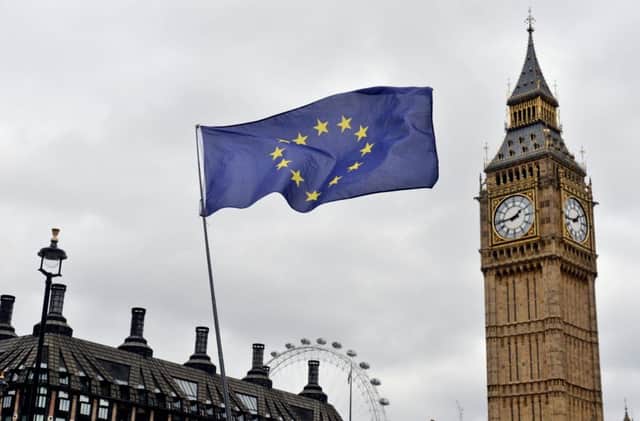 An EU flag flies in front of the Houses of Parliament in Westminster, London, Photo: Victoria Jones/PA Wire