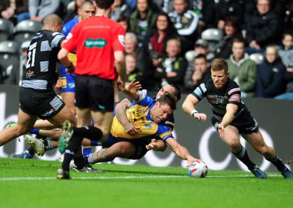 Leeds Rhinos' Joel Moon dives over to score a try in the first period.
 Picture: Tony Johnson.
