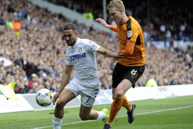 Kemar Roofe is challenged by Wolves' George Saville. PIC: Simon Hulme