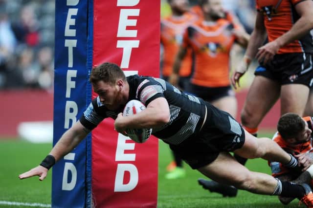 OPENING SALVO: Hull's Scott Taylor gets away from Castleford's Zak Hardaker to score the opening try. Picture: Jonathan Gawthorpe