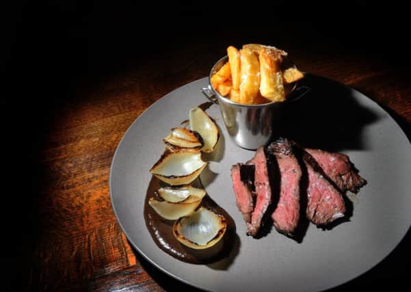 A MAIN COURSE: 32 day aged Kirkby Malzeard hanger steak, truffle & parmesan dripping chips, mushroom ketchup, and roast onion.