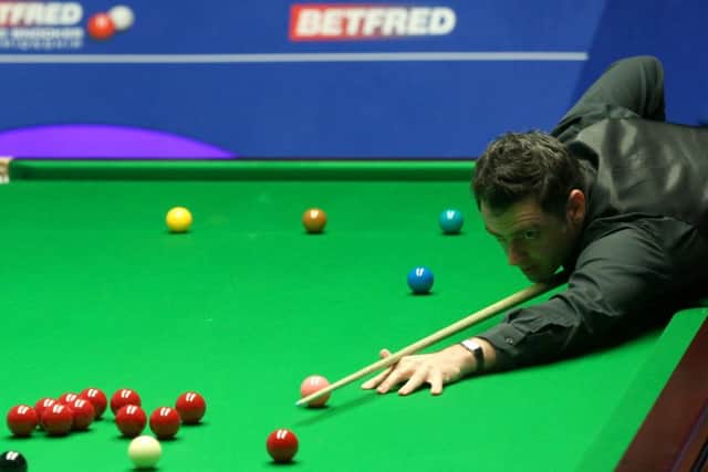 Ronnie O'Sullivan in action against Ding Junhui.