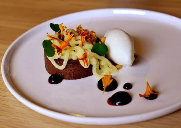 Chocolate and tangerine root ganache , pine nut crumb , blackcurrant  and buttermilk sorbet. PIC: Gary Longbottom