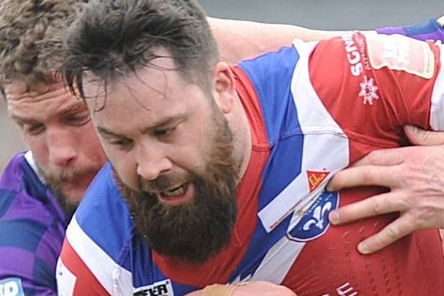 Craig Huby, marked his 300th career appearance with a try for Wakefield against Catalans Dragons.