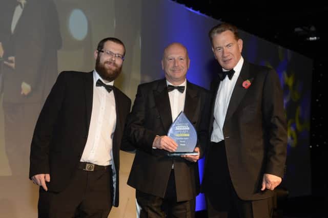 The winners of the Diversity award at The Yorkshire Post Excellence in Business Awards.  The team from PLUSS with Michael Portillo. Yorkshire Post Excellence in Business Awards 2016.  New Dock Hall.  4 November 2016.  Picture Bruce Rollinson