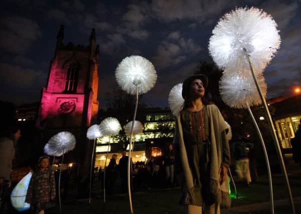Leeds Light Night.Gracie Murray aged 8 fro Oakwood looks at the Dandelions lights at Merrion Gardens, Leeds.6th October 2016 ..Picture by Simon Hulme
