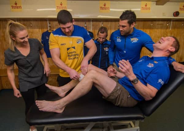 Date:8th May 2017.
Picture James Hardisty
Leeds Rhinos players offer their support ahead of huge charity challenge, by the Leeds Rhinos Foundation's Director of Rugby Bob Bowman, ahead of Bowman's 15 marathons in 15 days charity challenge. Three players Mitch Garbutt, Rob Burrow, Joel Moon, were under the supervison of beauty therapist Morgan Moon, during a charity leg wax on Bob Bowman, in the teams dressing room in preparation for the event.