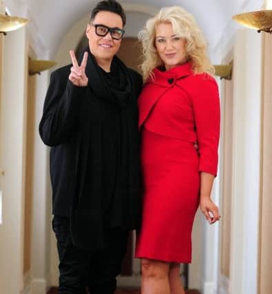 Gok and a model, wearing Working Wardrobe red suit, Â£99.50, at the Gok Wan Fashion Brunch Club at the Queens Hotel, Leeds, 6th May 2017. Picture by Simon Hulme